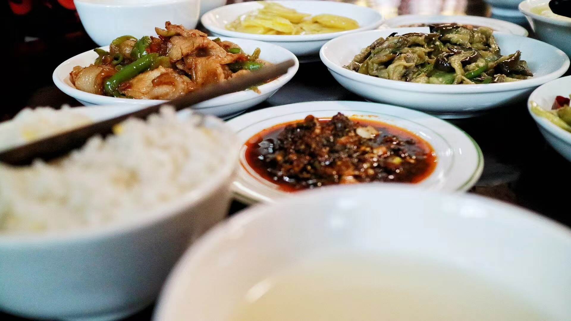 A simple mountain meal of rice, pale broth and small dishes