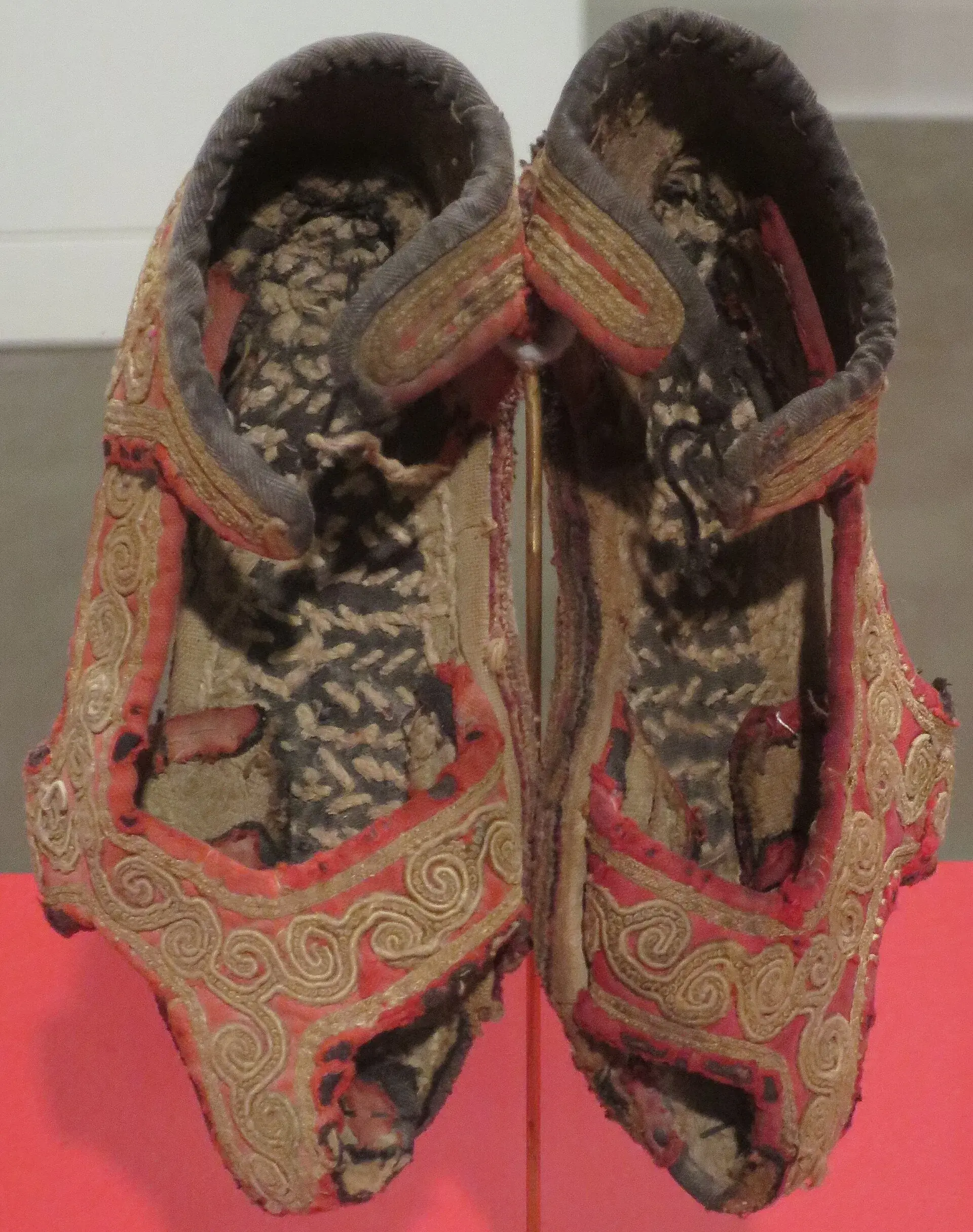Another antique pair, the cloth sole visible under the embroidery