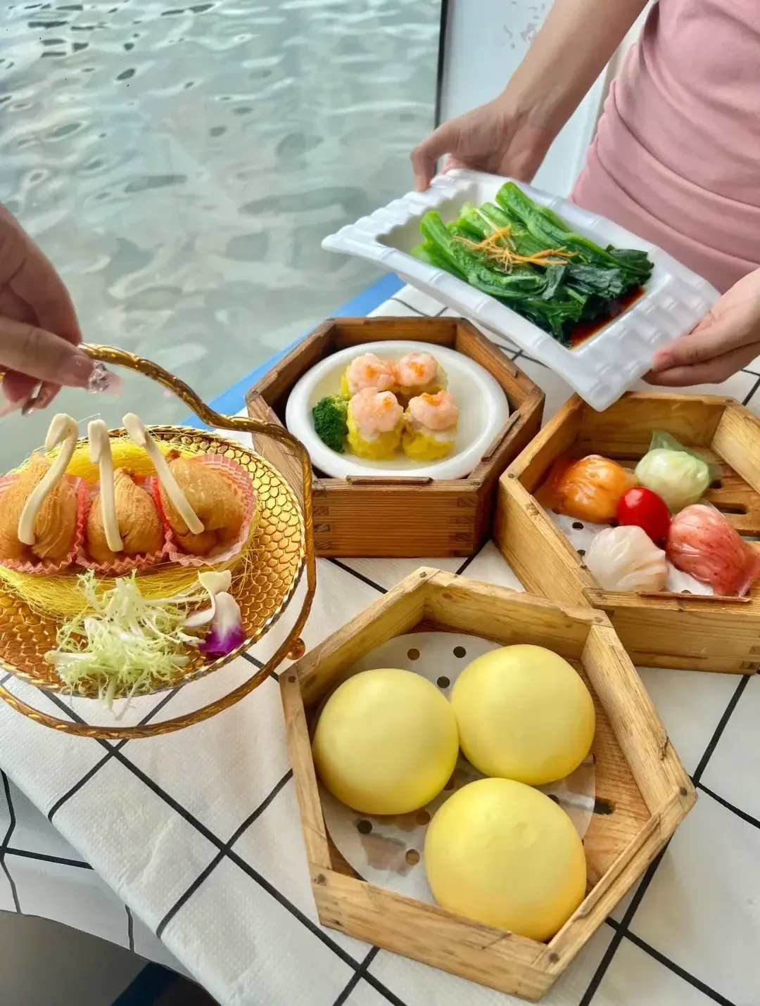 “One pot, two dim sum” at the floating teahouse, the river beyond the window