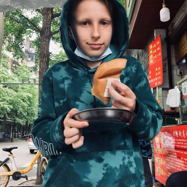Our eldest with a fresh dan hong gao by the stall