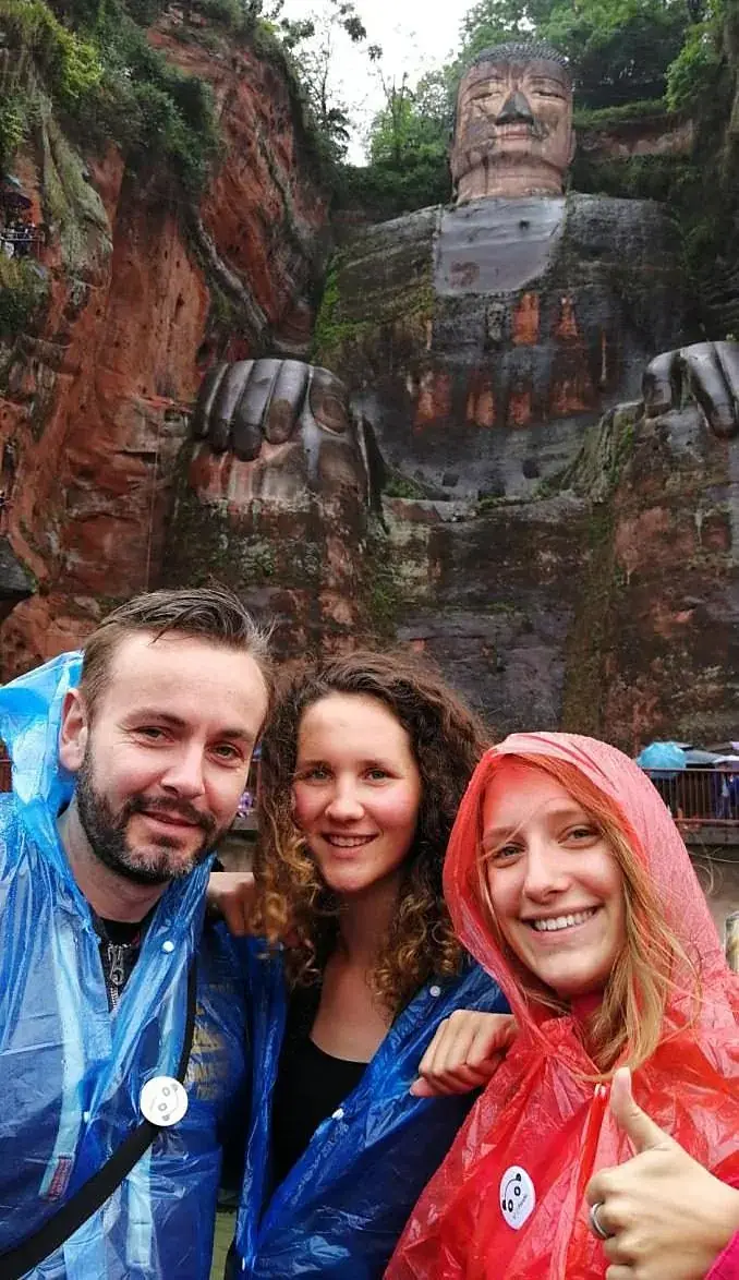 Guests with the Giant Buddha behind