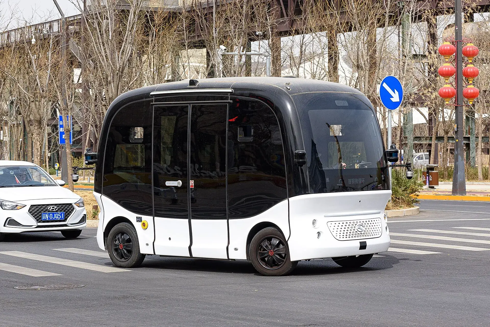A driverless shuttle bus on a city street