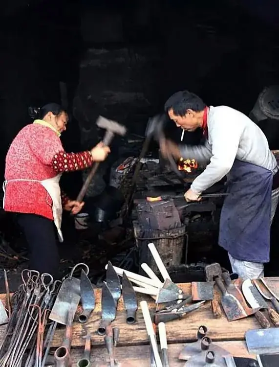 A blacksmith's shop hung with tools