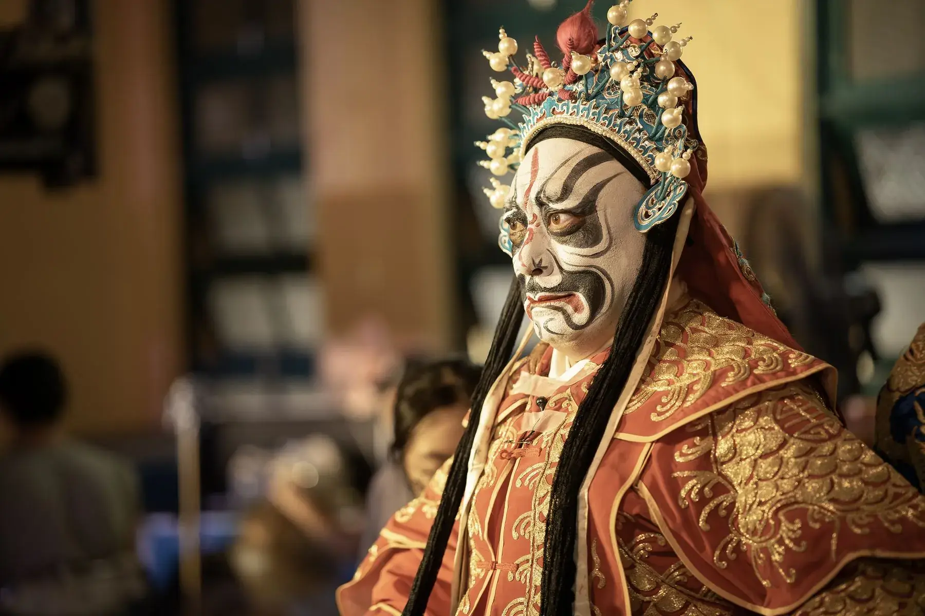 Embroidered opera costumes on a rack