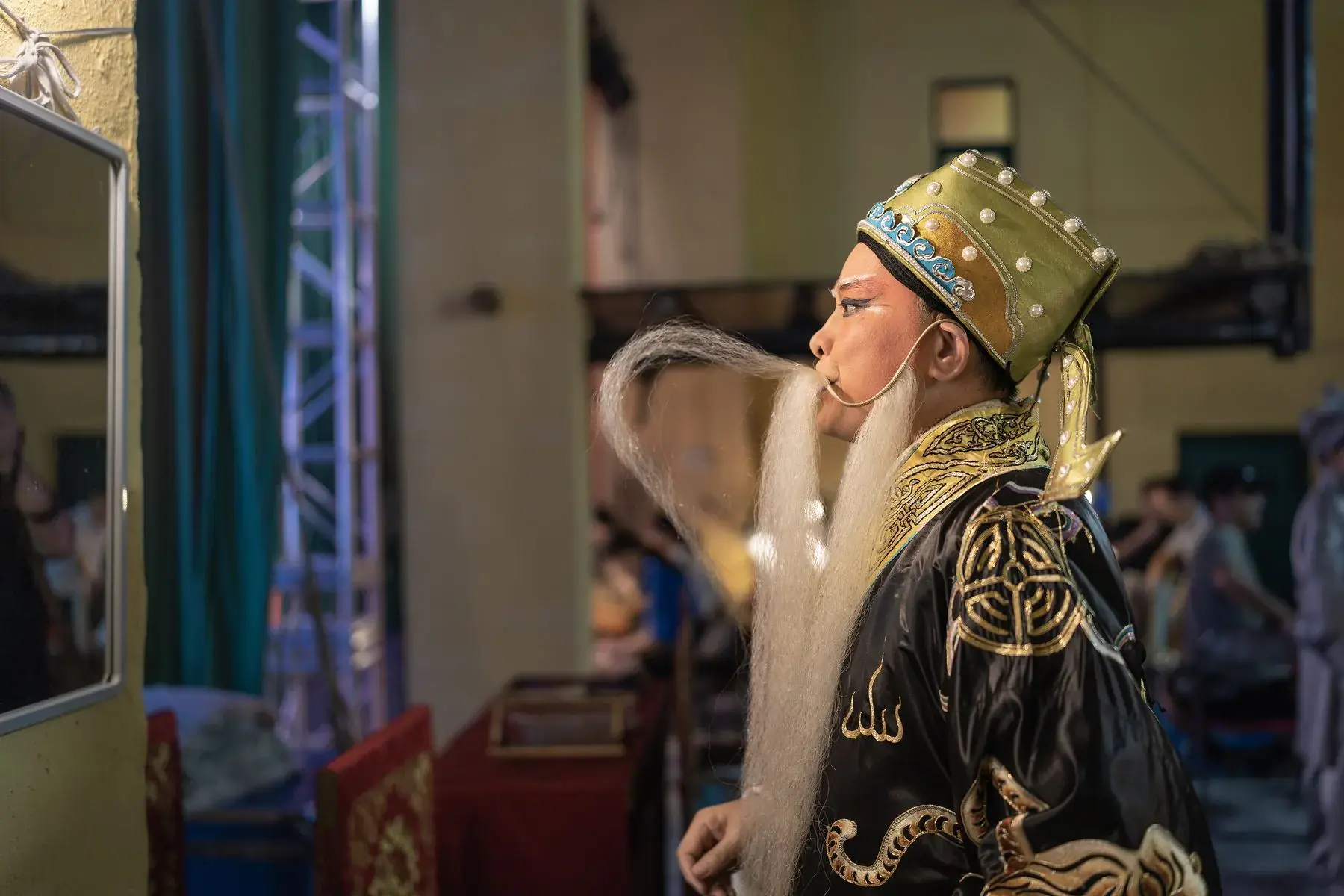 A performer in an ornate gold headdress