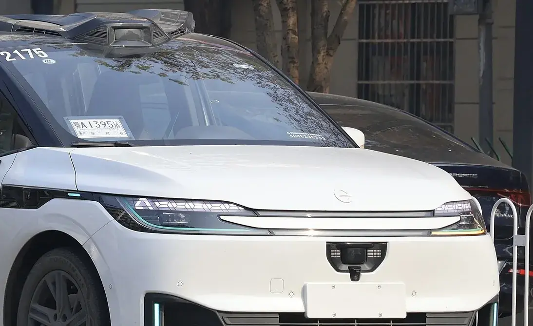 The side of an Apollo Go robotaxi, sensors along the roofline