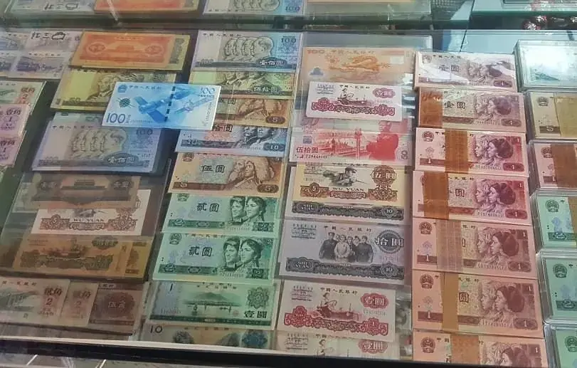 Rows of old banknotes laid out at the antique market