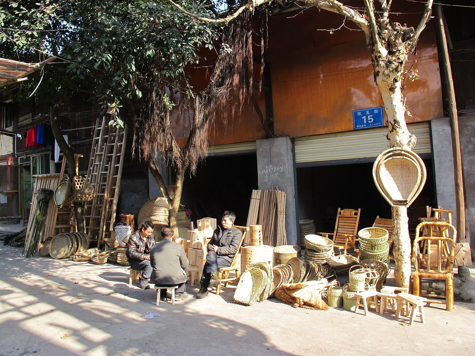 A wooden shopfront hung with bamboo ware in a Sichuan old town