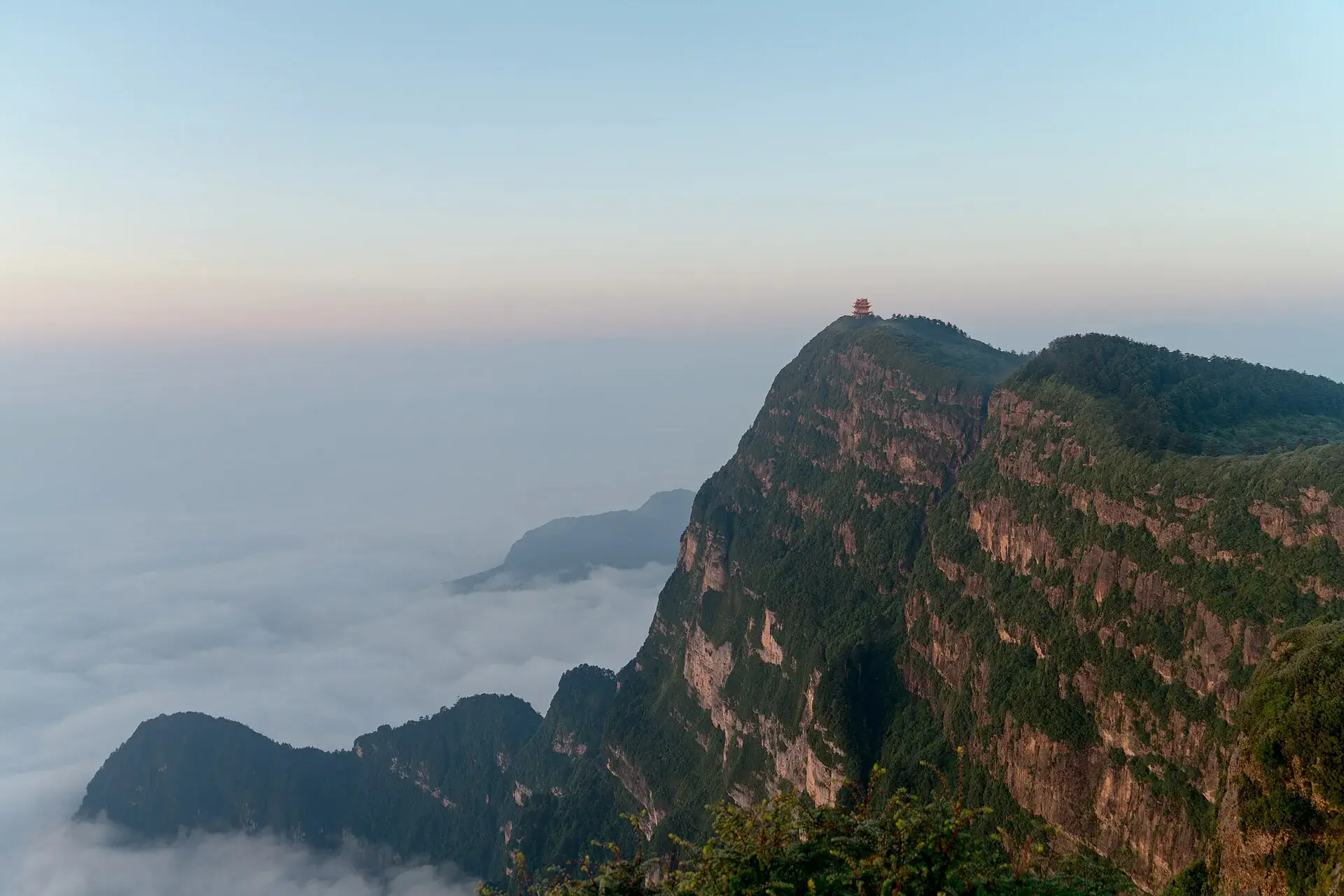 The summit ridge of Mt Emei above a sea of cloud at first light