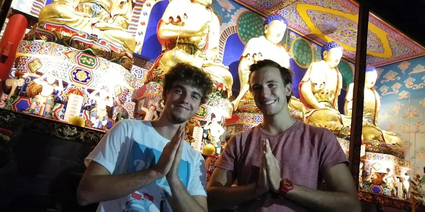 Guests inside a painted temple hall