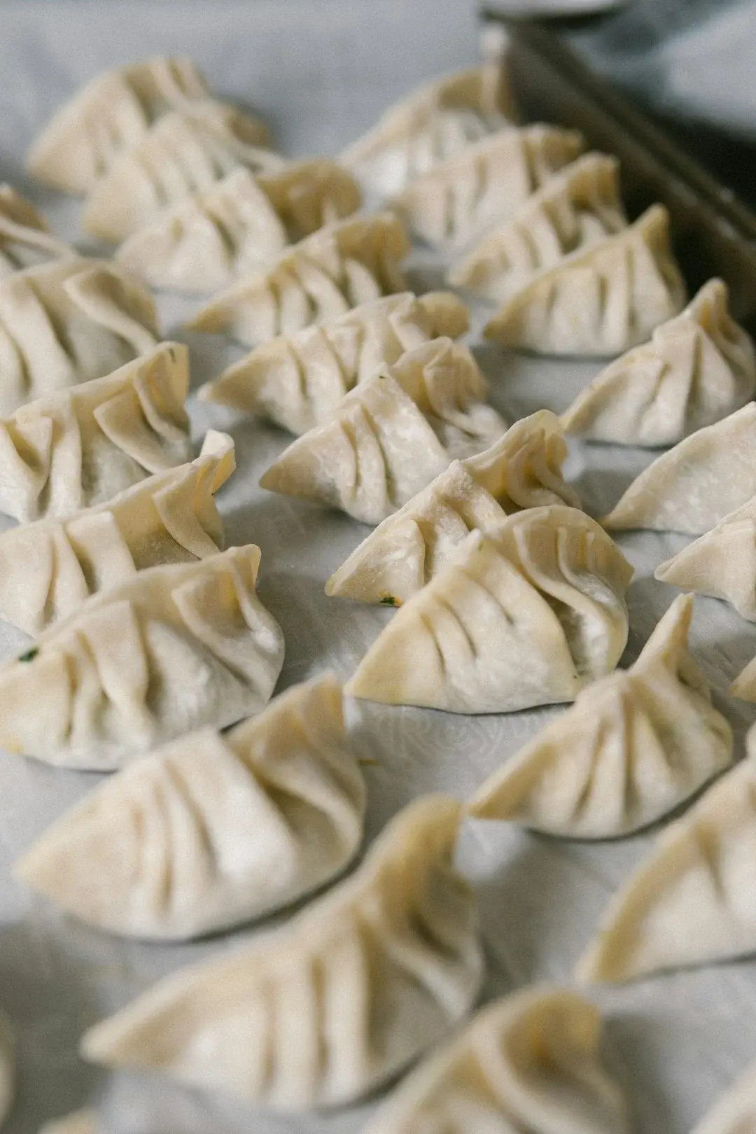 A bamboo steamer of xiaolongbao soup dumplings, a Shanghai specialty