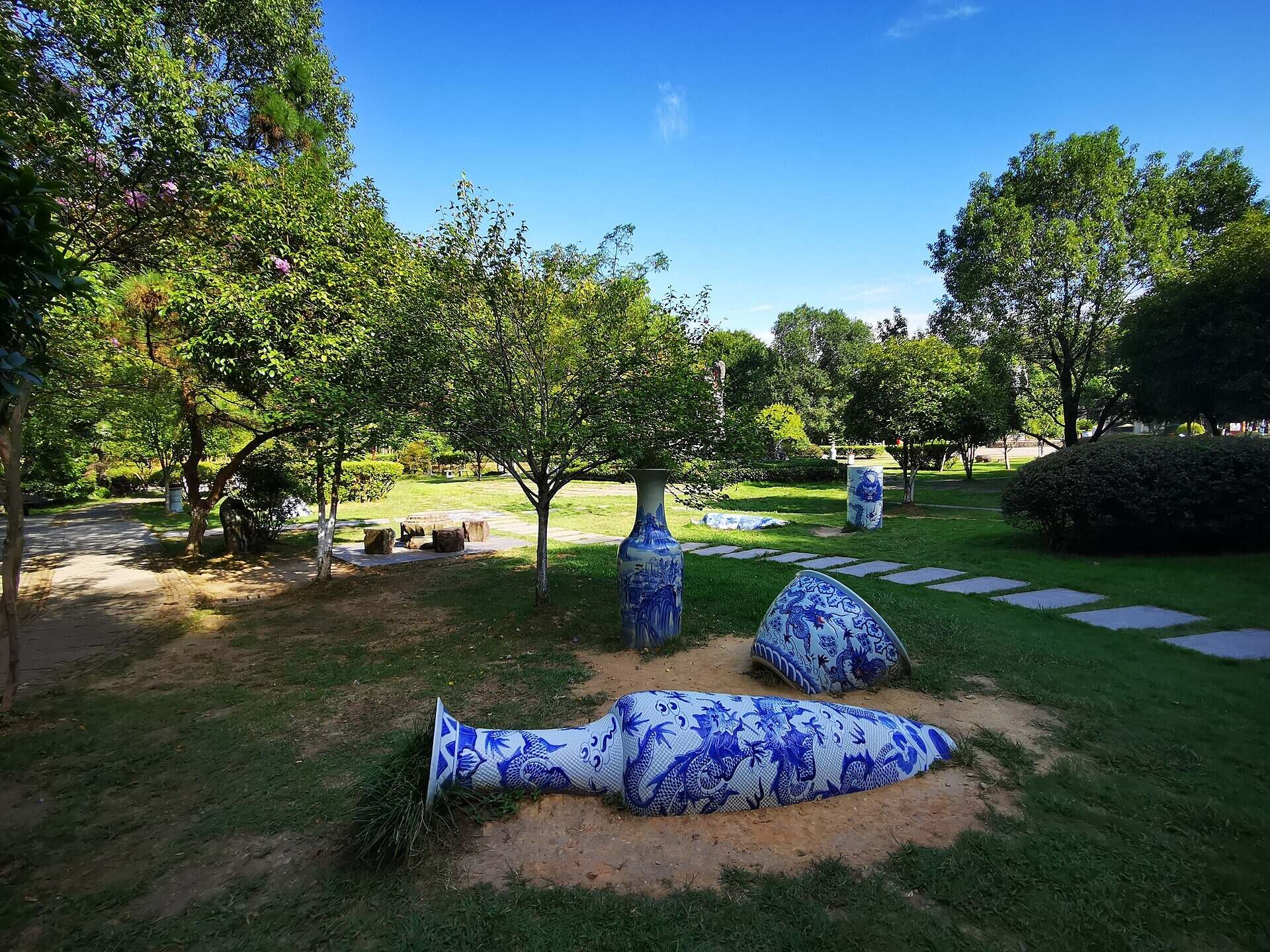 Blue-and-white porcelain vases on the grass at the Jingdezhen Ancient Kiln Folk Customs Museum