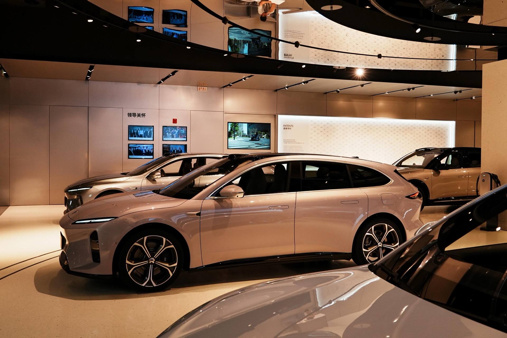 Electric cars lined up inside a showroom