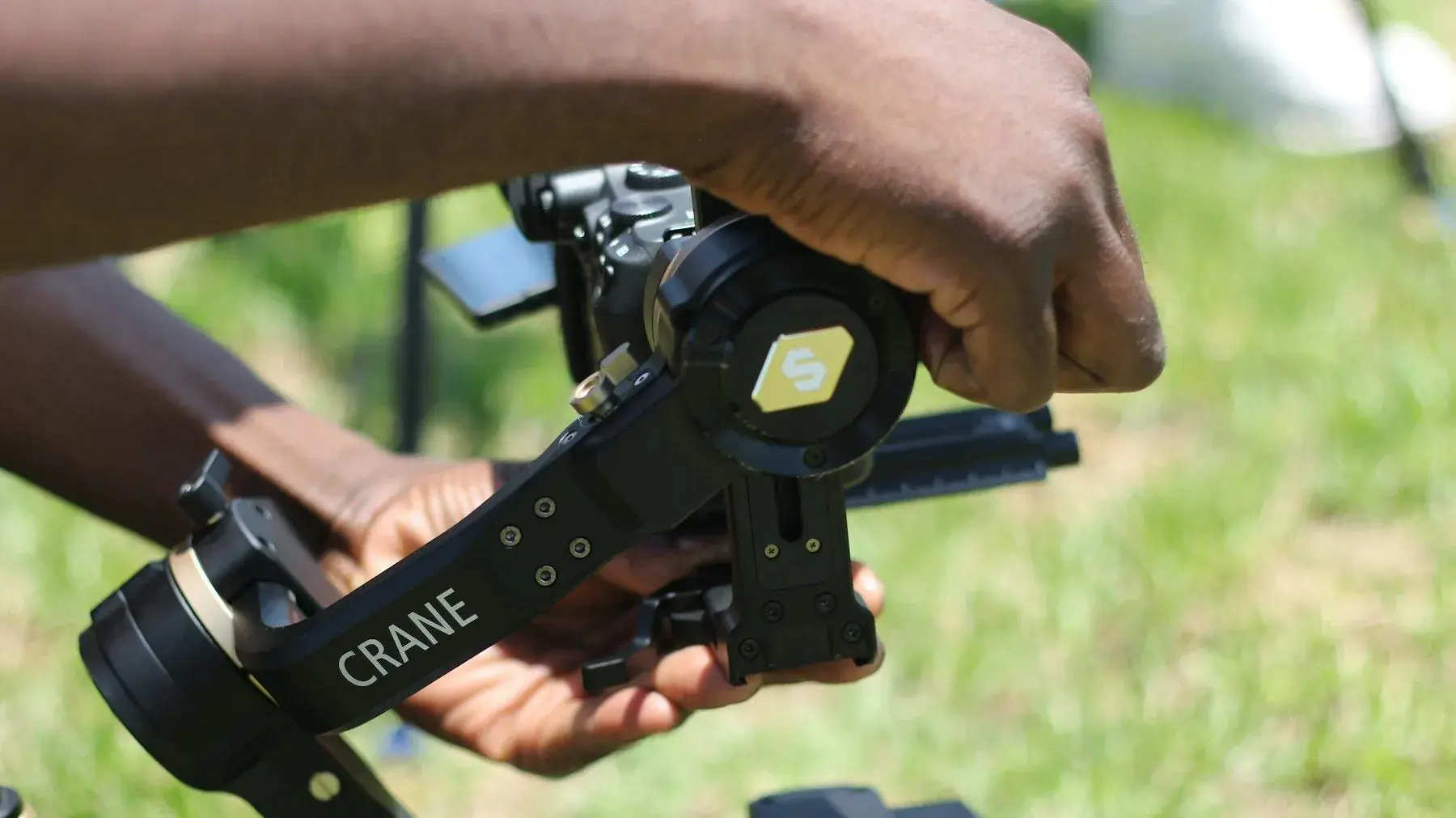 Hands holding a camera gimbal