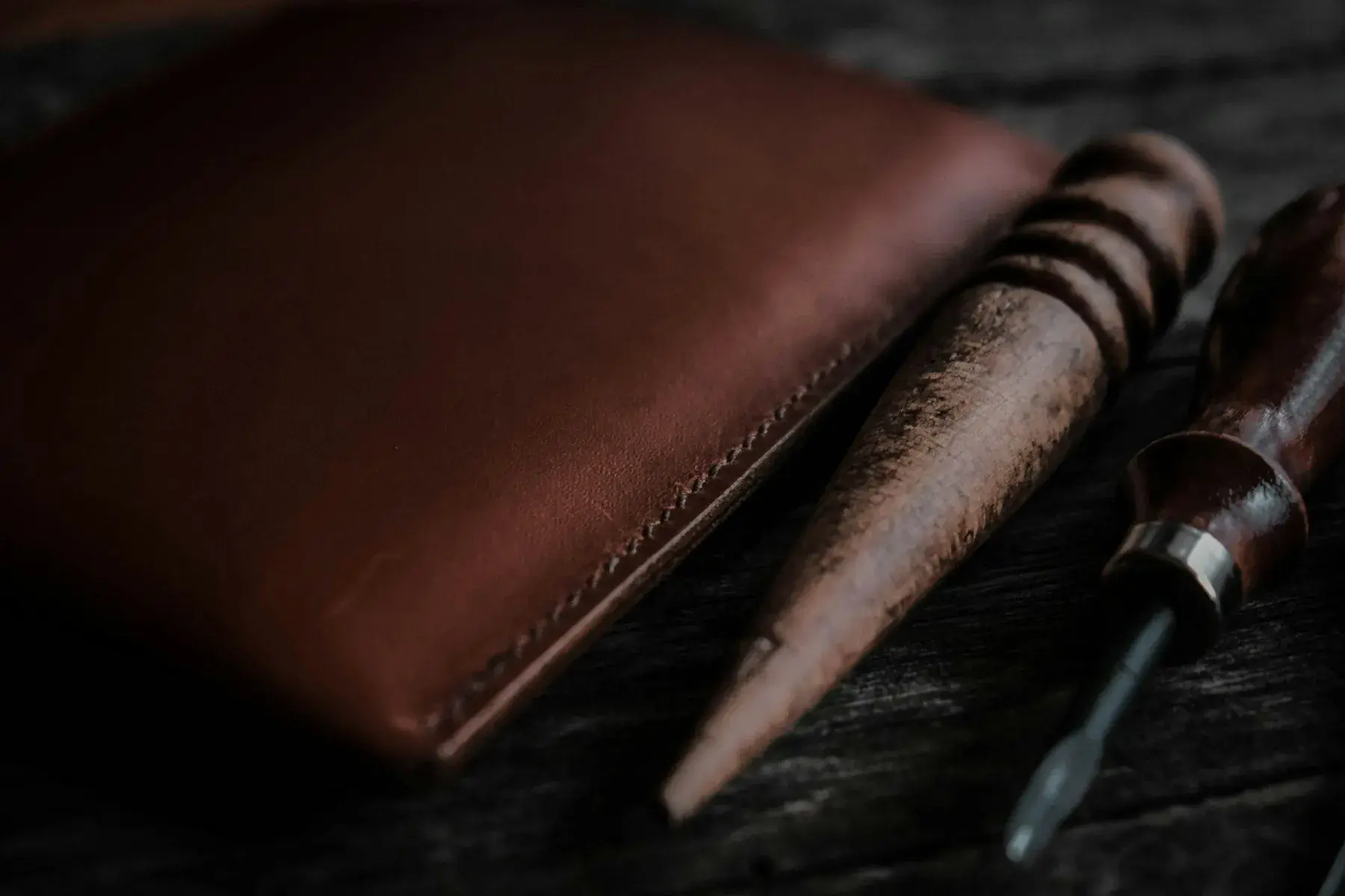 Rolled leather hides stacked in a workshop