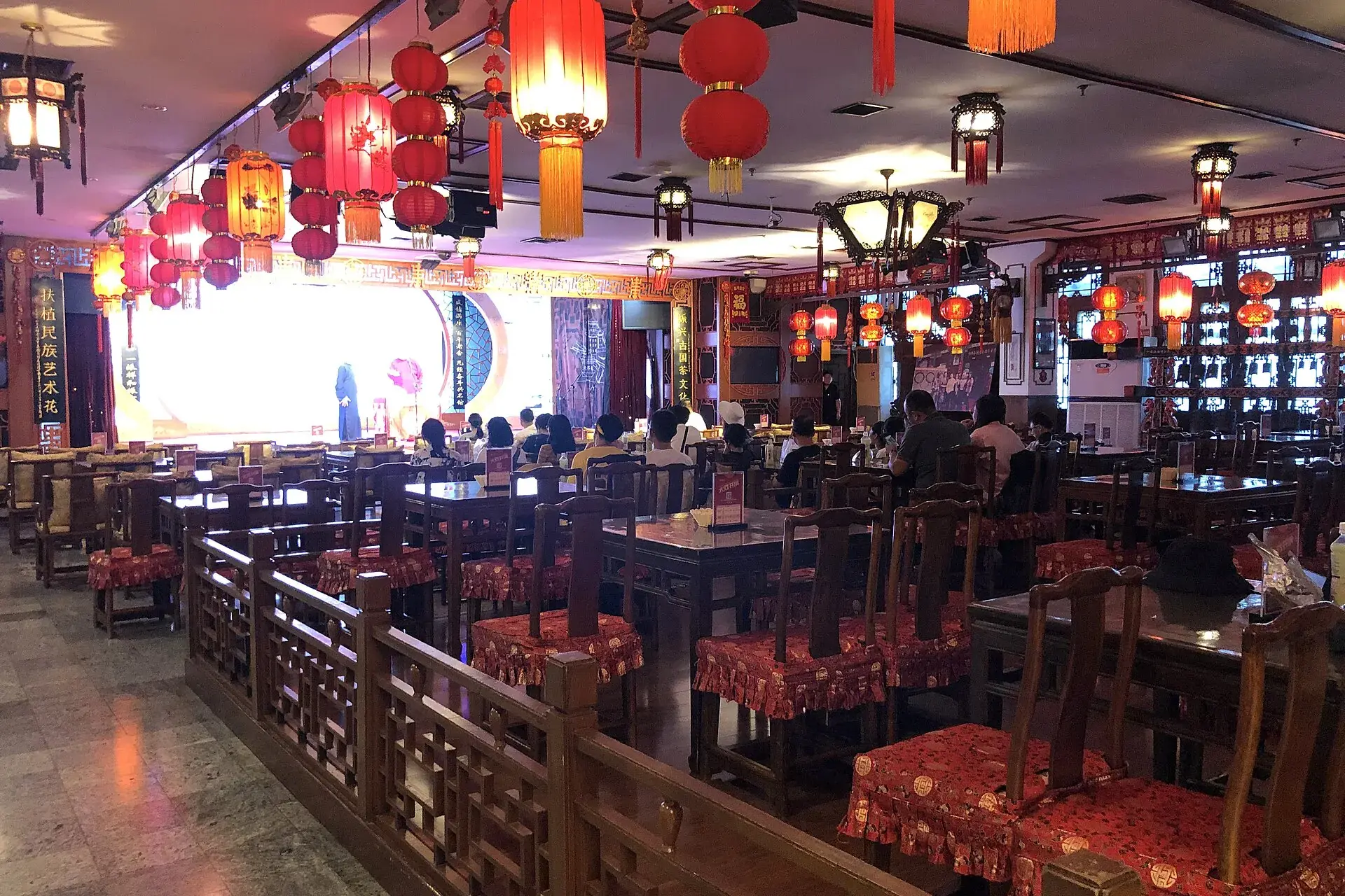 The hall of Laoshe Teahouse, hung with red lanterns