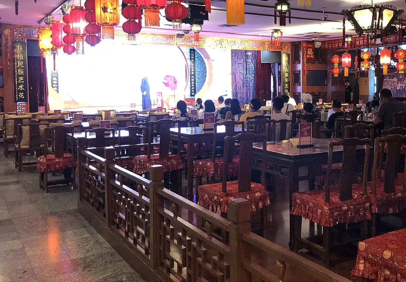 Wooden chairs and tables set out in the teahouse hall