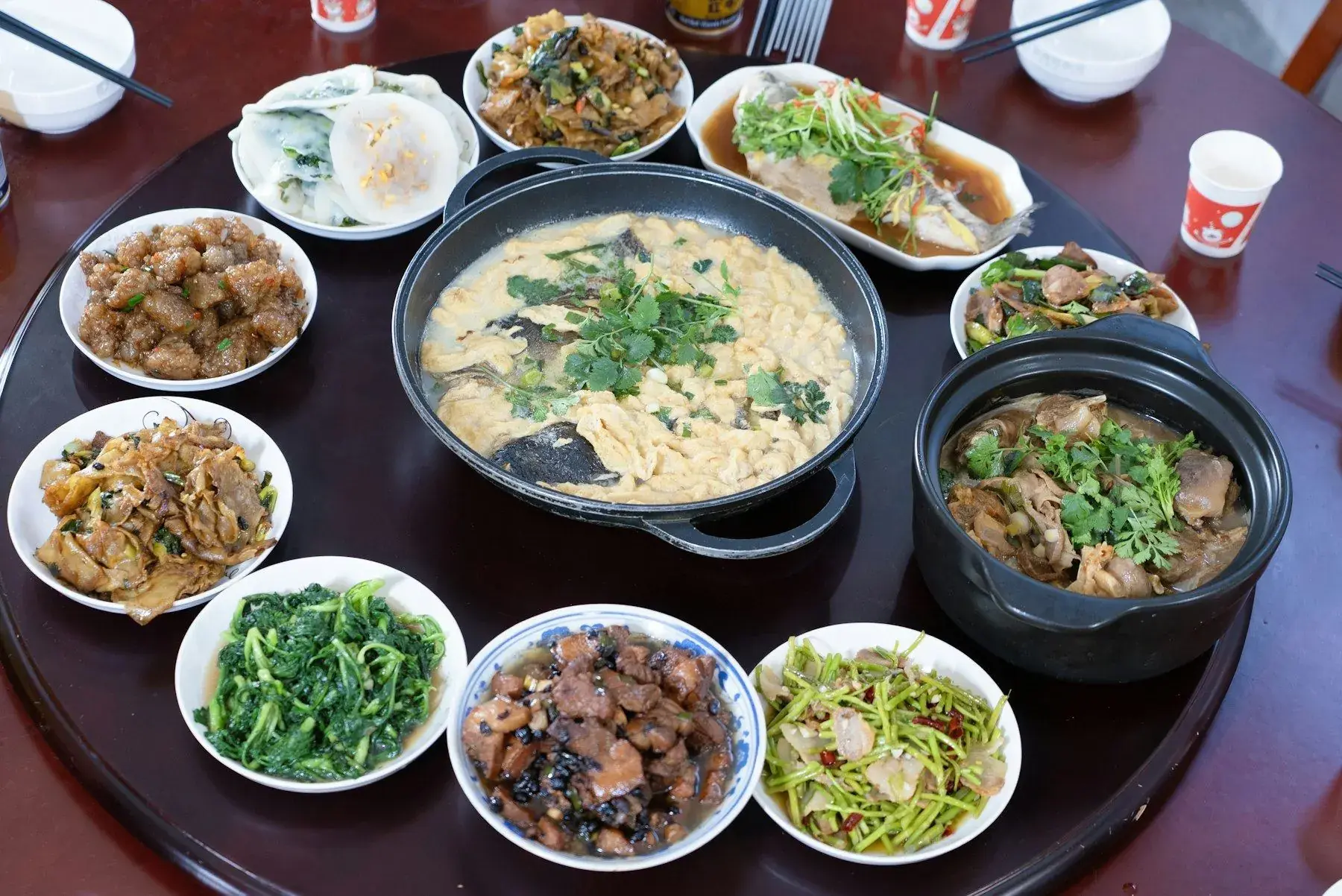 A home-cooked meal laid out on a table in a village house