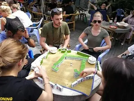 Guests around a mahjong table