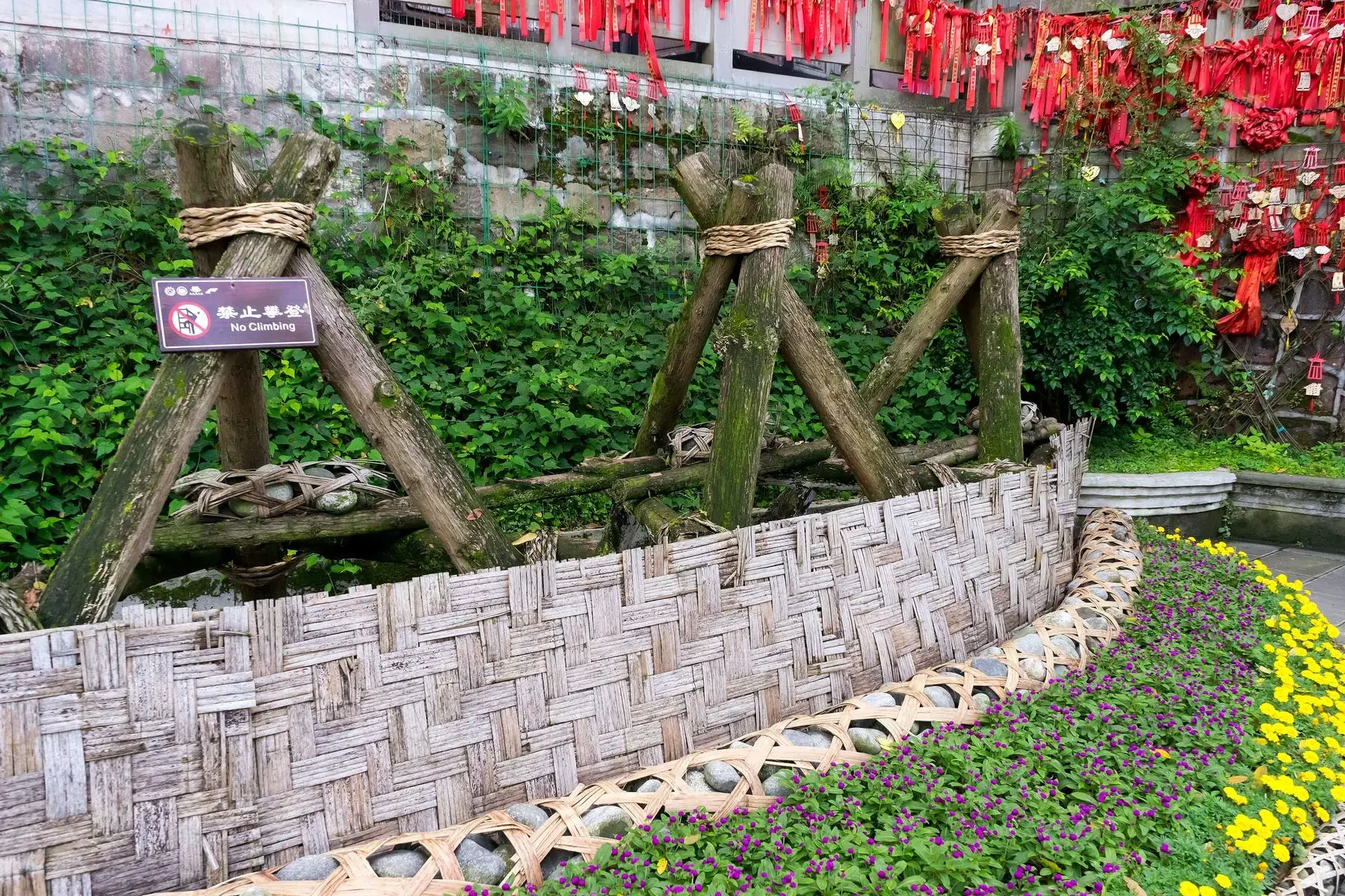 A woven bamboo fence around a mountain vegetable plot