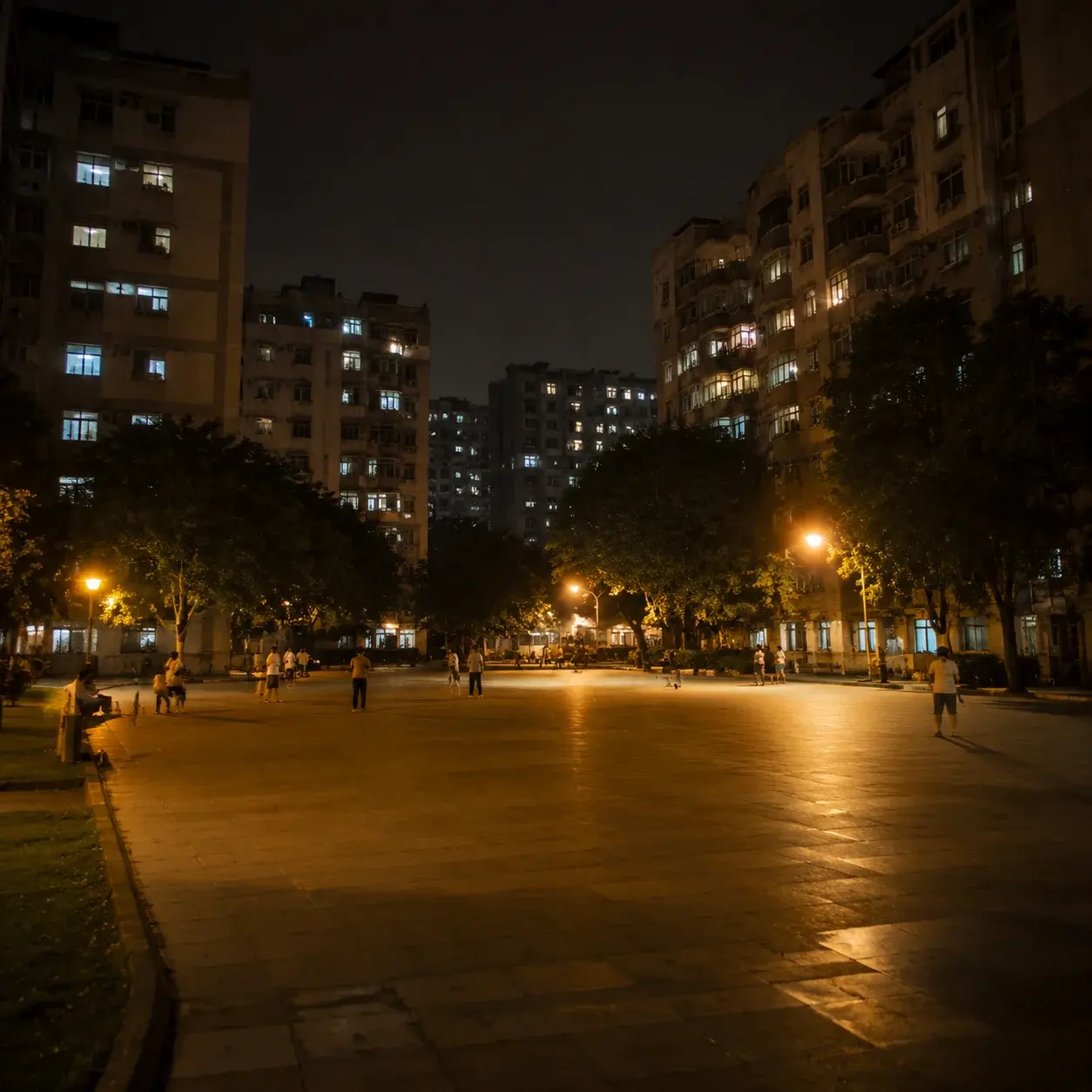 A residential plaza after dark — where the evening square-dancing shift gathers