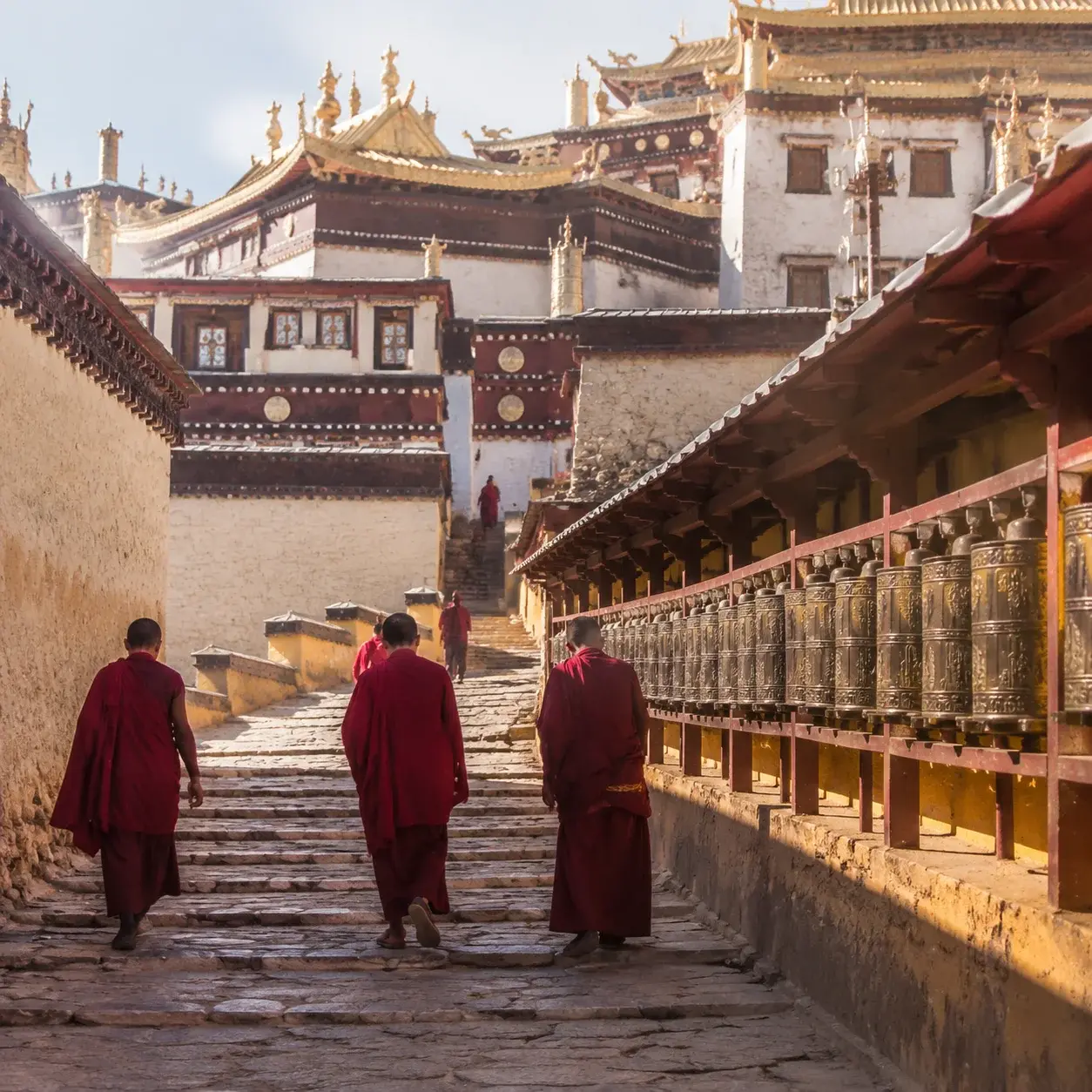 Monks and prayer wheels at the working Songzanlin Monastery near Shangri-La