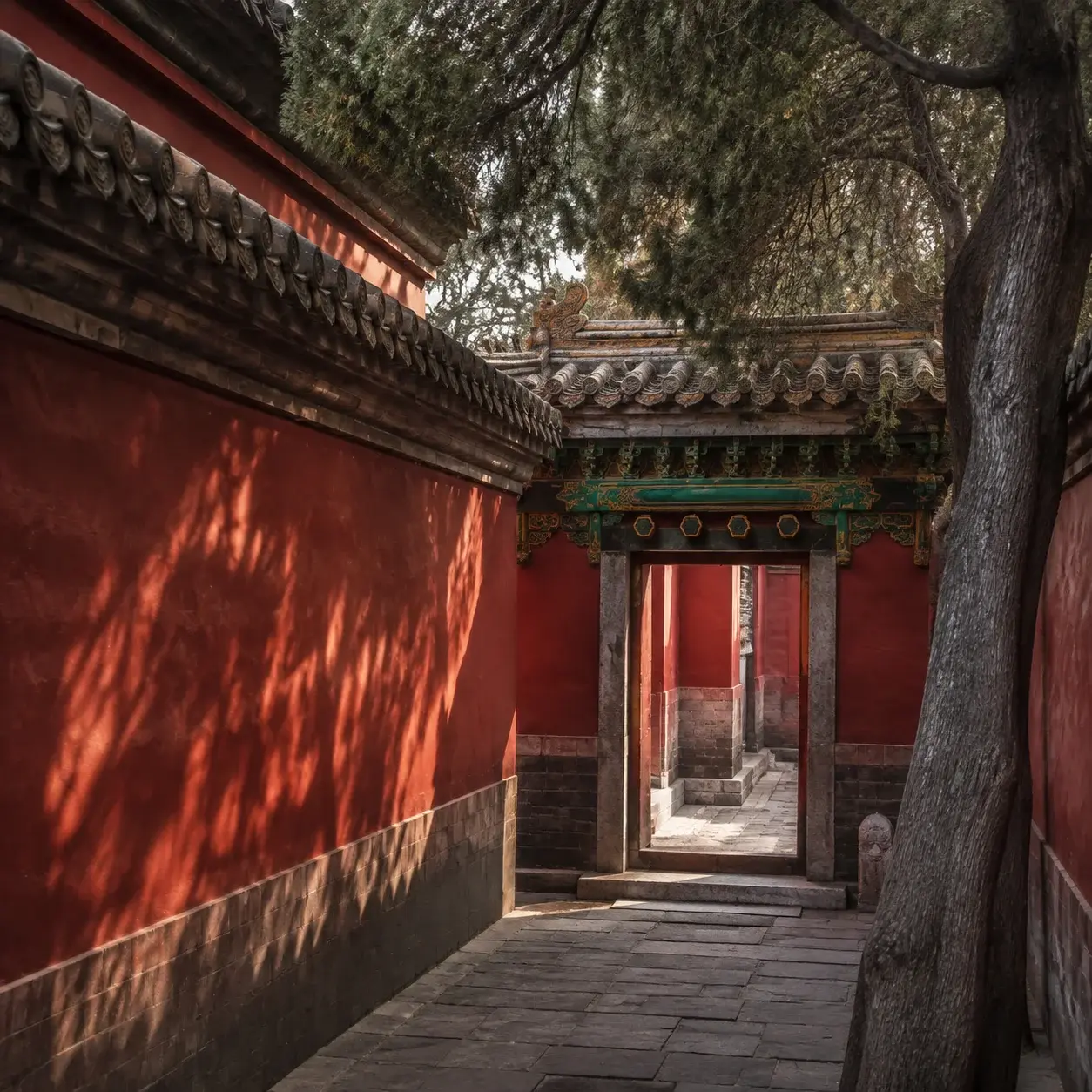 A quiet side courtyard with vermilion walls in the Forbidden City in Beijing
