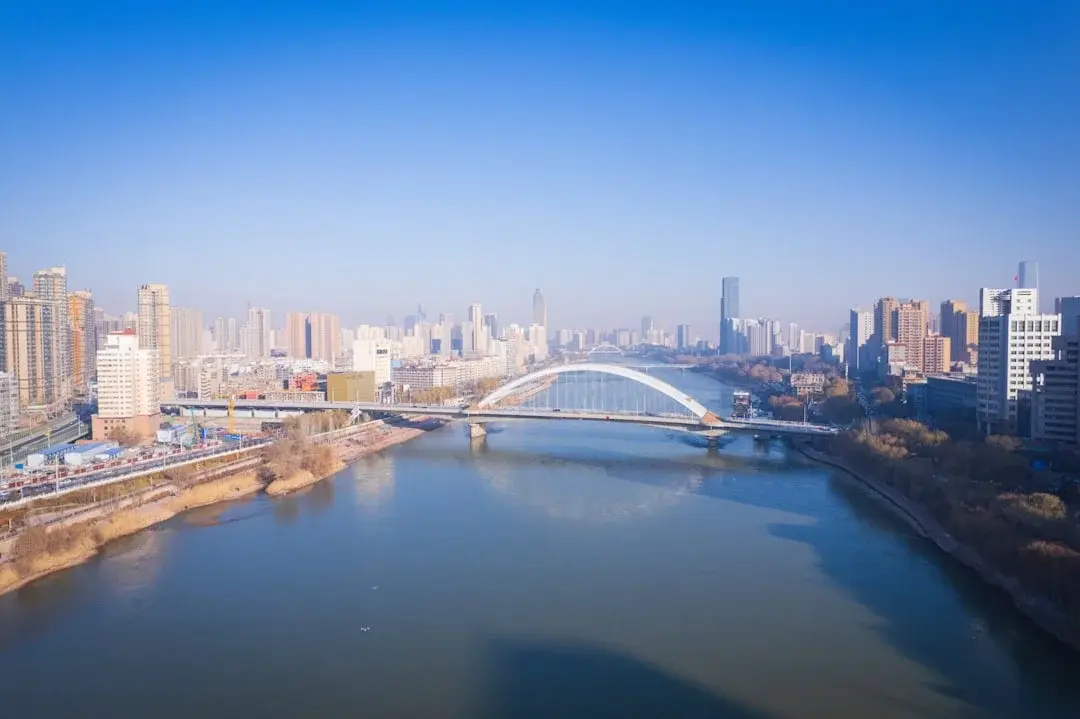 The Yellow River flowing through Lanzhou past the historic Zhongshan Bridge