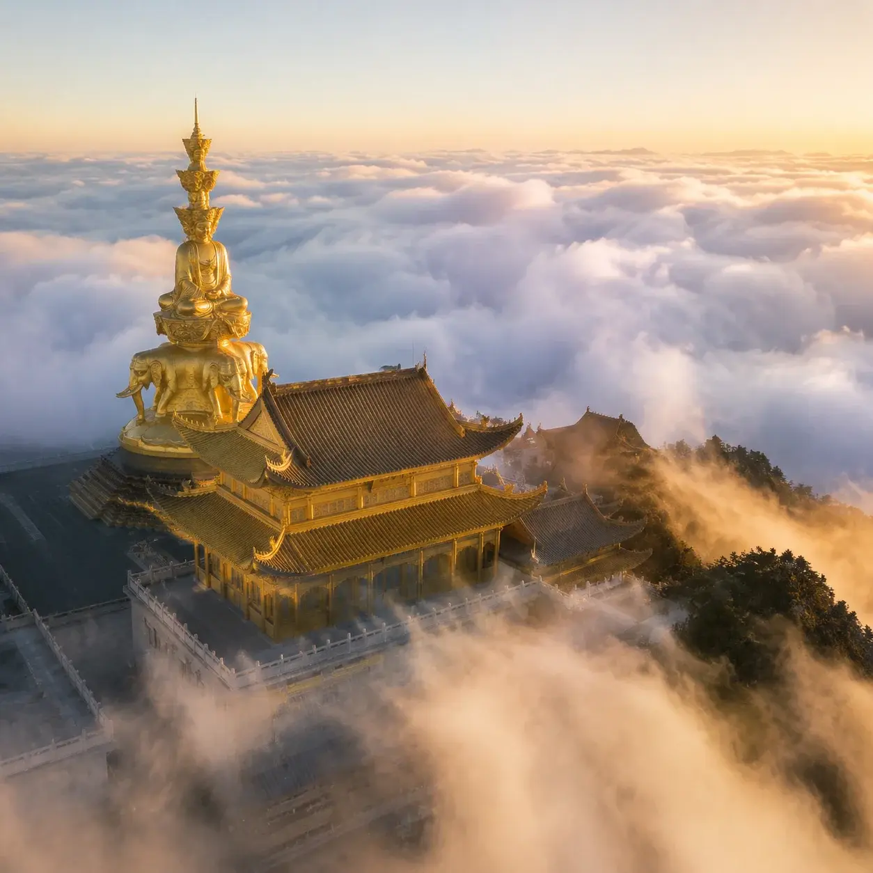 The gilded Golden Summit temple of Emei Shan rising from a sea of clouds at dawn