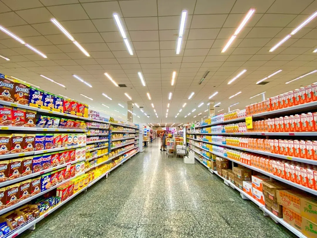 Shelves of baby and household products in a Chinese supermarket aisle