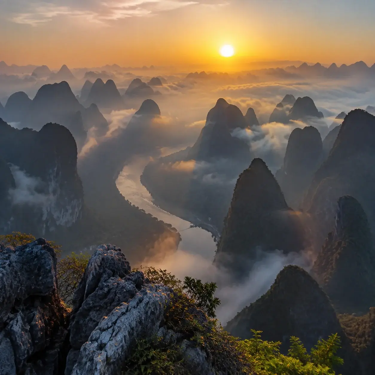 Sunrise over a bend of the Li River seen from a hilltop viewpoint