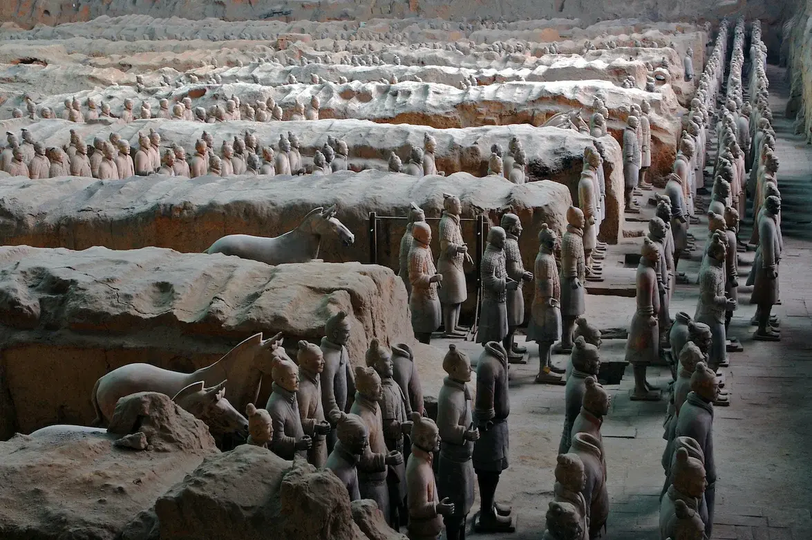 Rows of life-size Terracotta Warriors standing in the excavation pit near Xi'an
