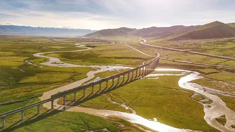 A train crossing the high-altitude plateau on the Qinghai-Tibet Railway